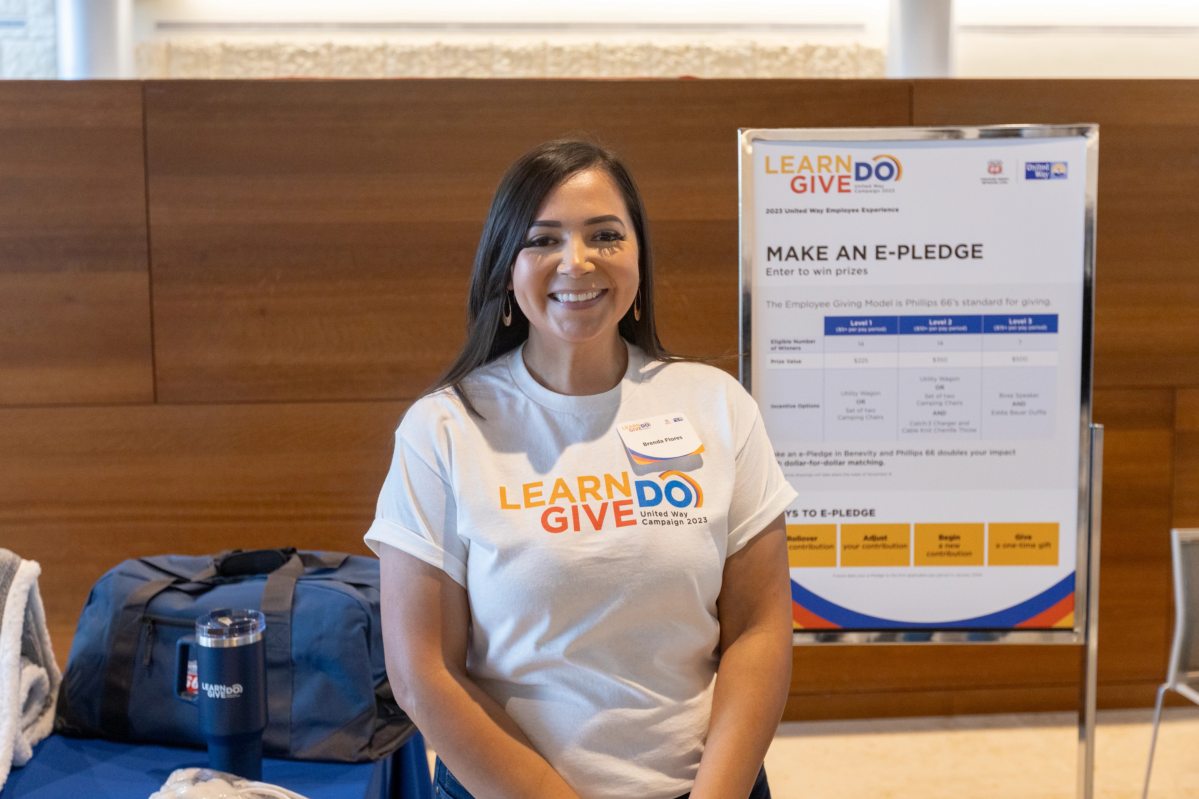 Phillips 66 employee helping to maintain one of Houston's biggest parks, removing invasive plants and replacing with native.